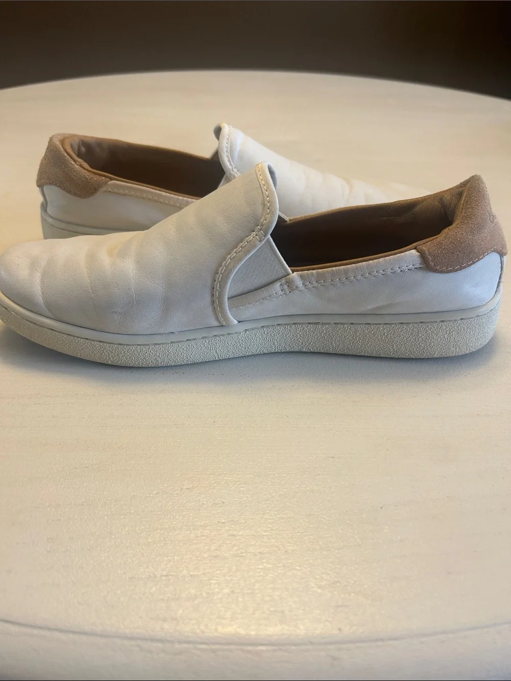 UGG women’s White Slip-On Leather Loafers with Tan Heel Accent